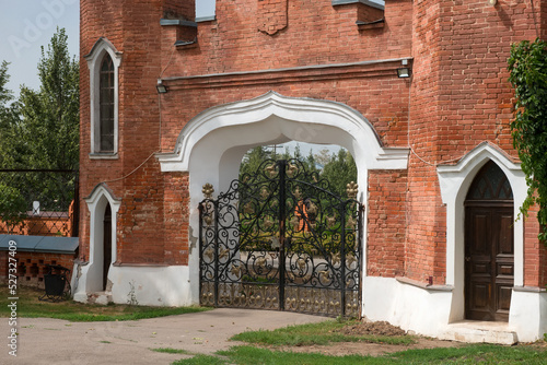 Ramon, Voronezh Region, Entrance gate with a tower and clock. The palace complex of the Oldenburgskys. This is the only place of residence of royal persons in the Chernozem region. photo