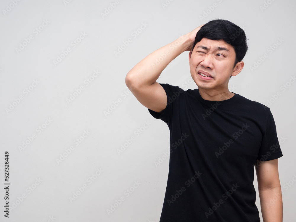 Young man black shirt hodld his head feels headache isolated Young man black shirt hodld his head feels headache isolated