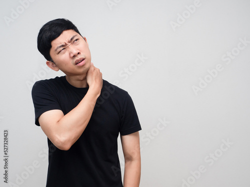 Asian man feels pain his neck from office syndrome