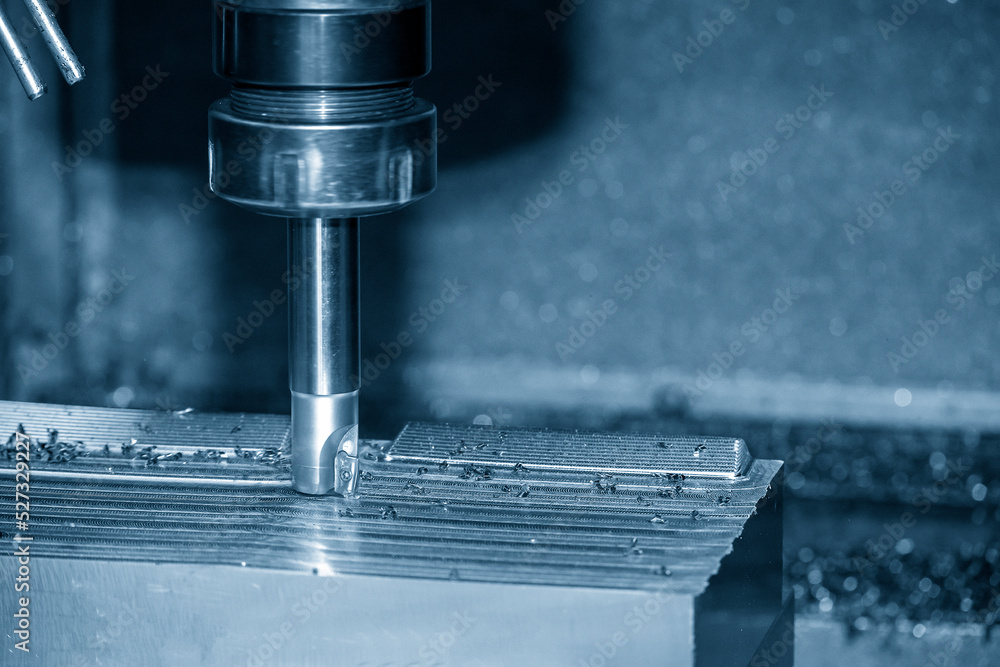 Close up scene the CNC milling machine rough cutting the injection mold parts by indexable tools. Close up scene the CNC milling machine rough cutting the injection mold parts by indexable tools.