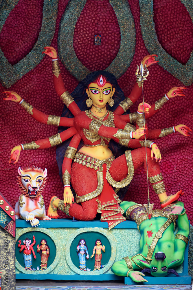 Idol of Goddess Devi Durga at a decorated puja pandal in Kolkata, West Bengal, India. Durga Puja is a famous and major religious festival of Hinduism that is celebrated throughout the world.
