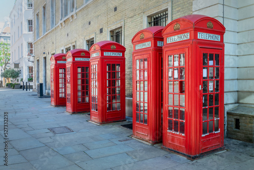 Five red phone booths in a row in Covent garden  London  UK