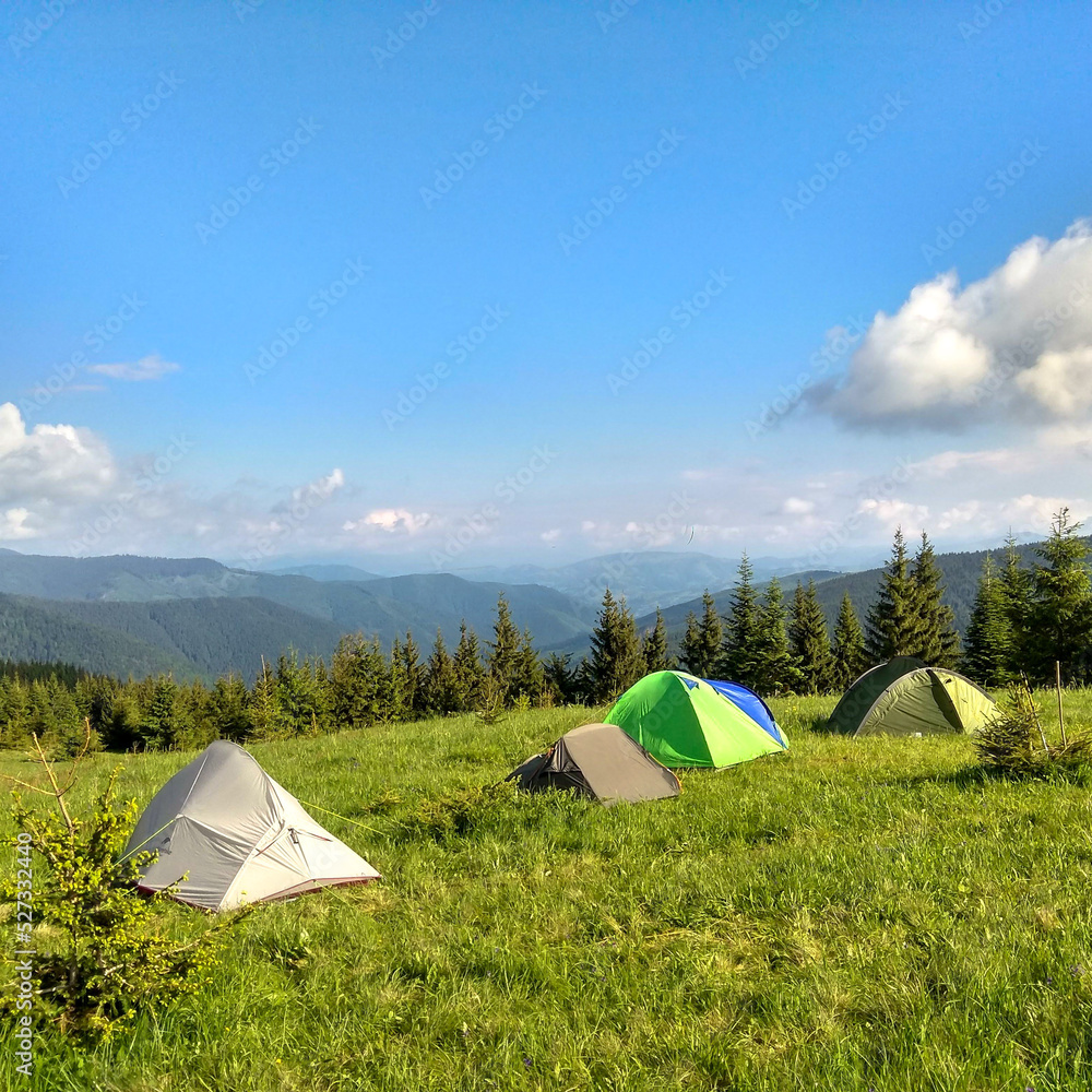 a tent on the slopes of high mountains, magical nature, endless sky a tent on the slopes of high mountains, magical nature, endless sky