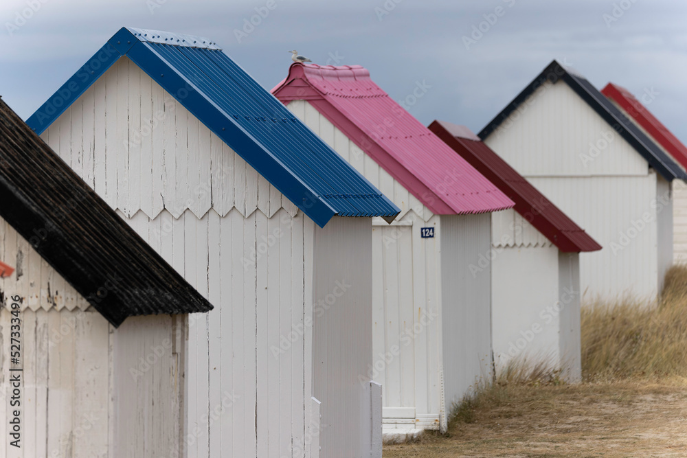 Beach cabins in Gouville sur Mer, Manche, Normandy, France in various lights - obrazy, fototapety, plakaty 