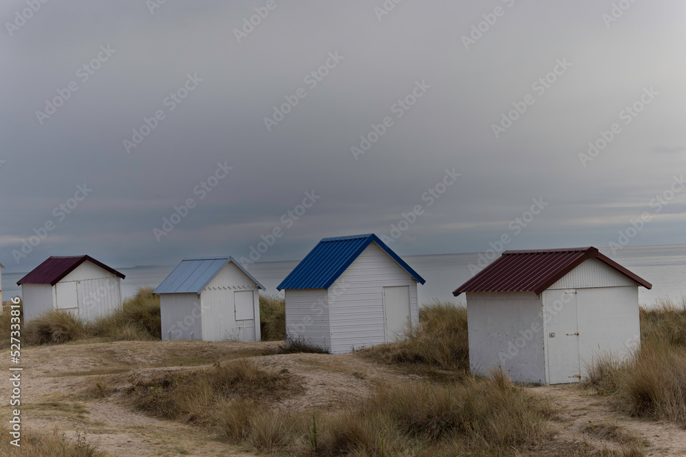 Beach cabins in Gouville sur Mer, Manche, Normandy, France in various lights Beach cabins in Gouville sur Mer, Manche, Normandy, France in various lights