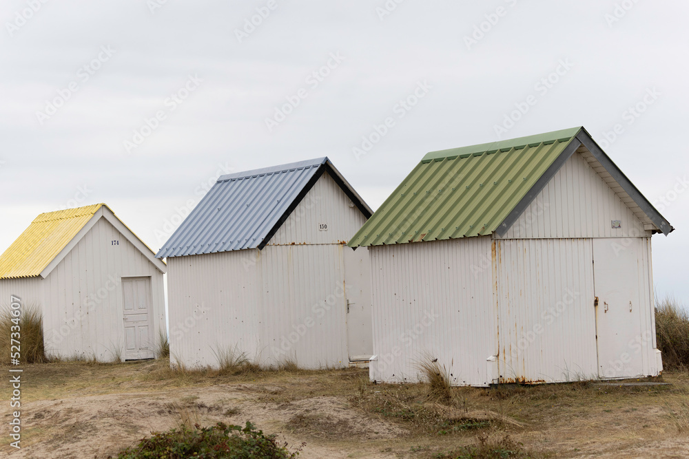 Beach cabins in Gouville sur Mer, Manche, Normandy, France in various lights Beach cabins in Gouville sur Mer, Manche, Normandy, France in various lights