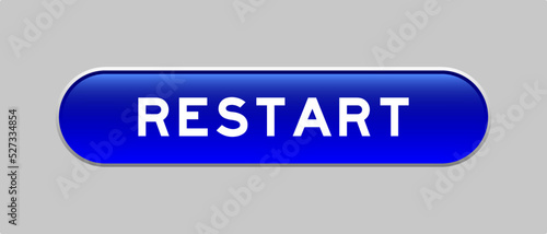 Blue color capsule shape button with word restart on gray background