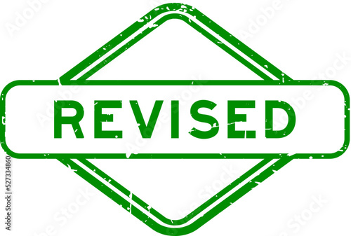 Grunge green revised word rubber seal stamp on white background