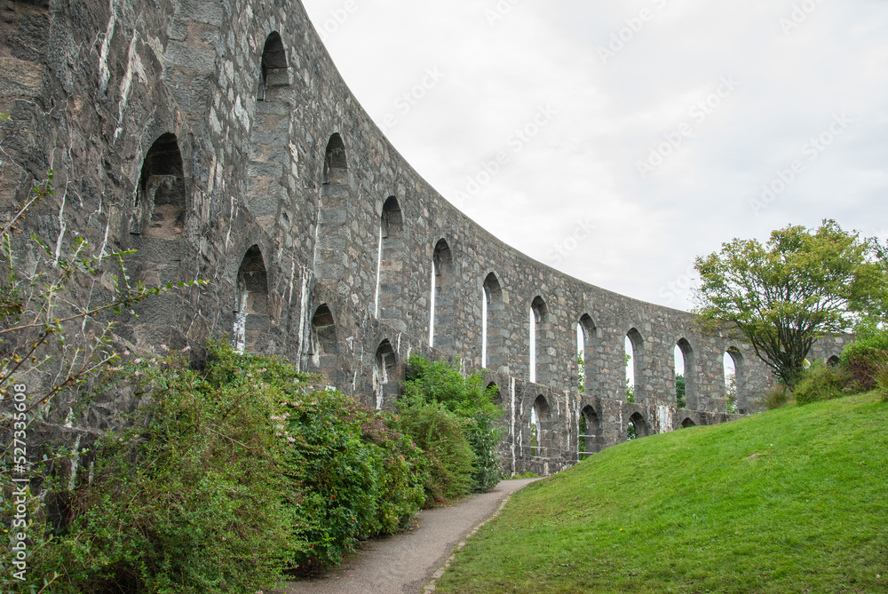 Lancet arches of McCaig's Tower aka McCaig's Folly prominent tower built of Bonawe granite on Battery Hill overlooking the town of Oban in Argyll, Scotland, UK