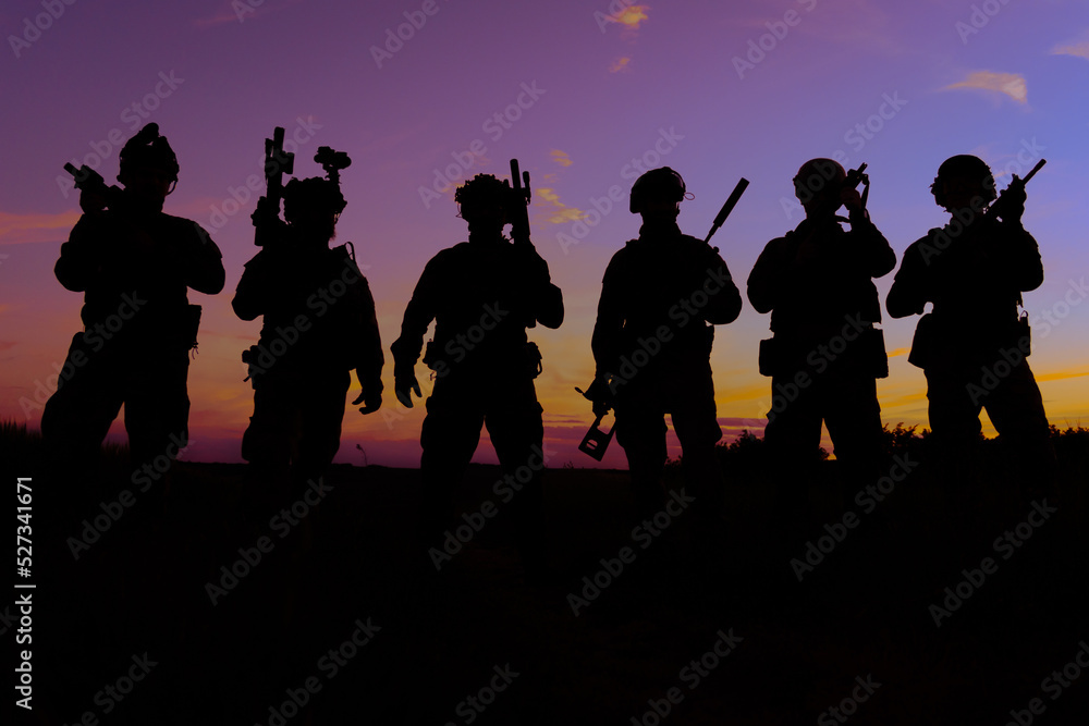 A group of soldiers at sunset