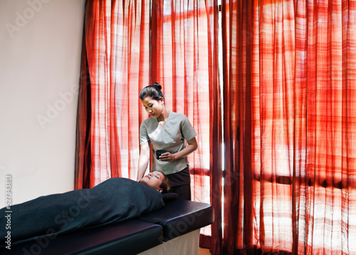 A woman receives a Dead Sea Mud Wrap at a Spa.  Siem Reap, Cambodia.