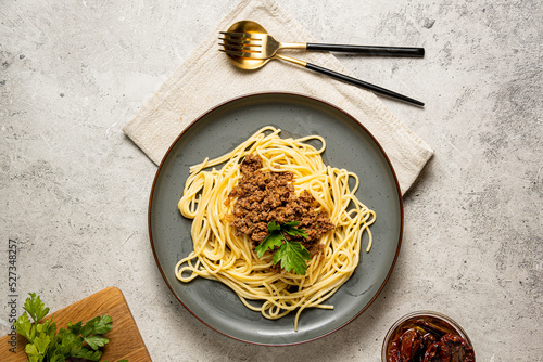 Spaghetti Bolognese in the grey plate on the grey backgroundSpaghetti Bolognese photo