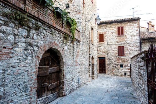 Old wooden door in a medieval building in Gubbio, Umbria, Italy, Europe