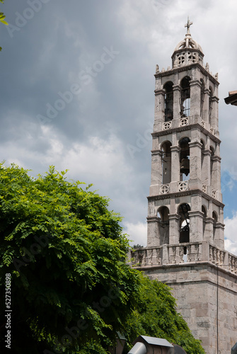 Stemnitsa, Greece / July 2022: Historic traditional village at the slopes of Mainalon mountain in the Peloponnese. Medieval bell tower. photo