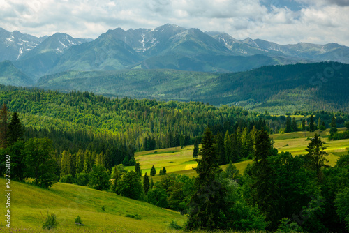 Fototapeta Naklejka Na Ścianę i Meble -  Green rolling hills and hgh tatras Mountains in Poland