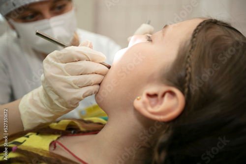 The child is being treated for teeth in the dental office.Child in the dentist office