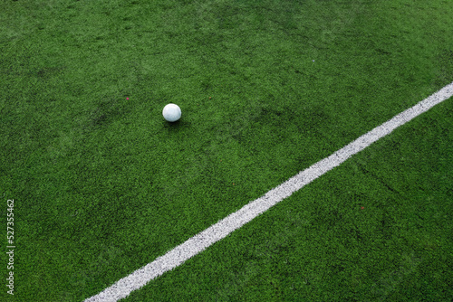 Soccer ball and a line of a football field