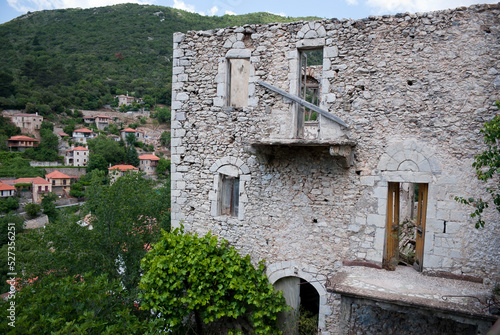 Stemnitsa, Greece / July 2022: Historic traditional village at the slopes of Mainalon mountain in the Peloponnese. Medieval ruins. photo
