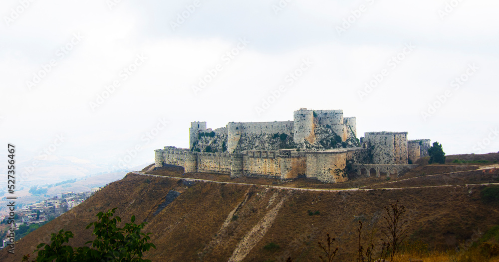 Obraz na płótnie Krak (Crac) des Chevaliers, also called (‎Castle of the Kurds), and formerly Crac de l'Ospital, is a Crusader castle in Syria and one of the most important preserved medieval castles in the world. w salonie