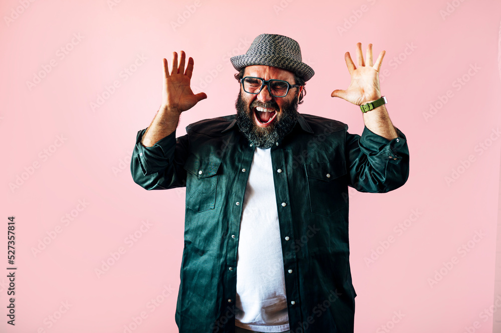 Fat man with a beard and raising his hands euphoric. Fat man with a beard and raising his hands euphoric.