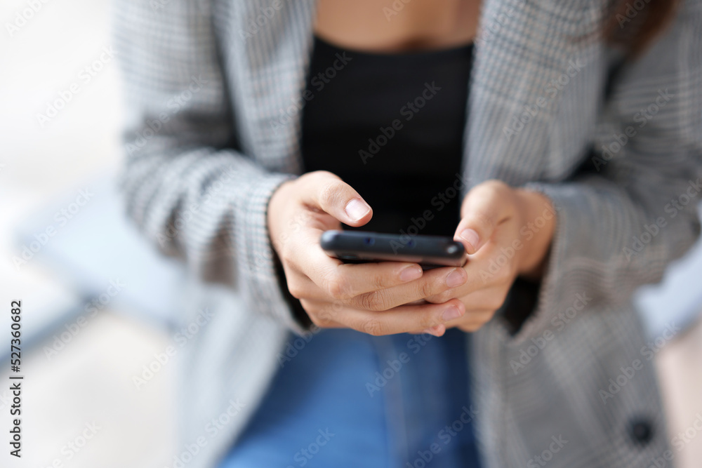 Close-up of a woman using a smartphone to work on various application including mobile transaction to send messages, LINE, and various business information sent via social media. Close-up of a woman using a smartphone to work on various application including mobile transaction to send messages, LINE, and various business information sent via social media.