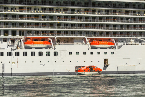 фотографія Descent of lifeboats to water from an ocean liner