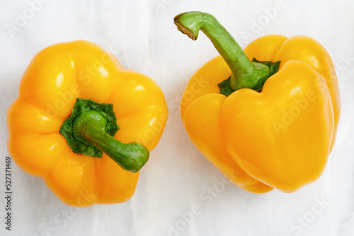 Studio shot of two yellow bell peppers photo