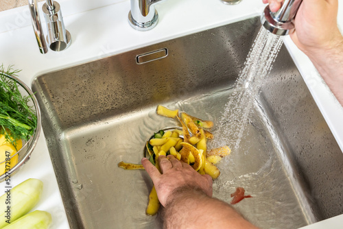 The work of the disposer for the disposal of food waste photo