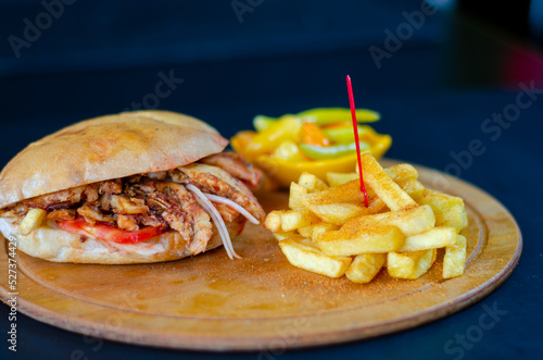 Chicken doner kebab in bread. french fries. selective focus
 photo