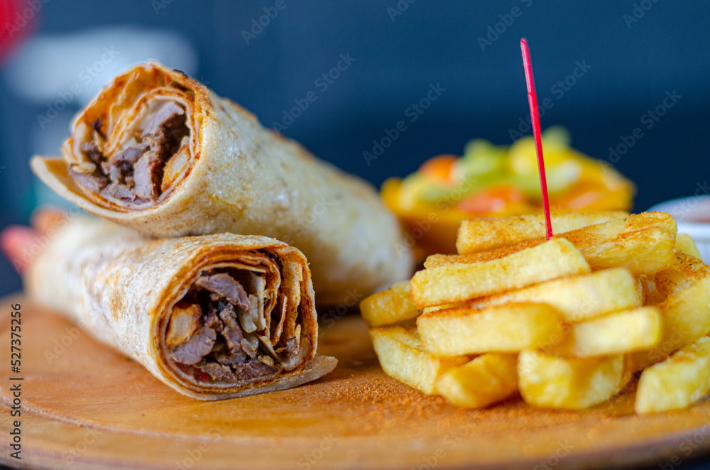 Doner kebab wrap in lavash bread. Traditional Turkish cuisine doner