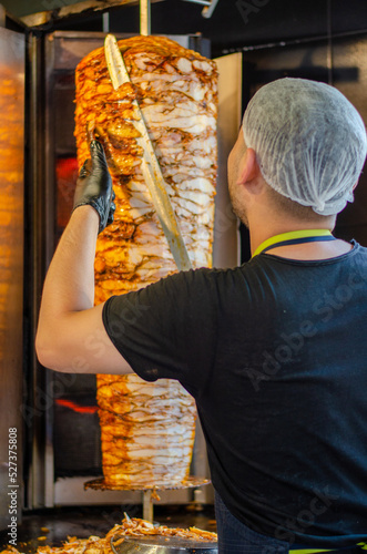 master chef who cuts doner kebab. doner master. selective focus