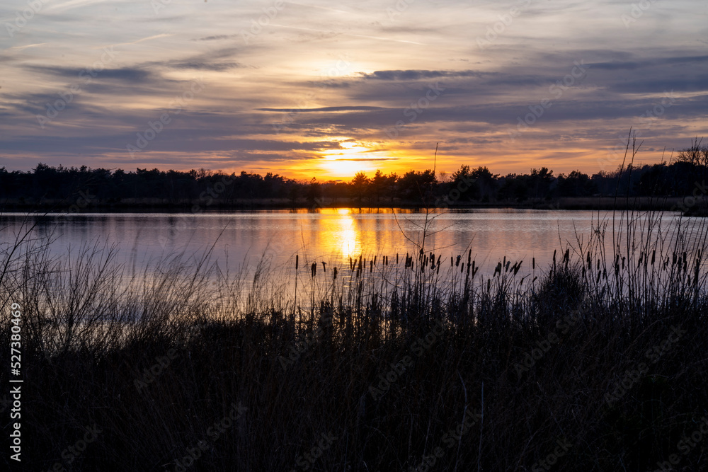 Sunset view over lakeside with beautiful colours and reflection Sunset view over lakeside with beautiful colours and reflection