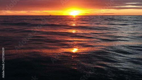 Beautiful ocean waves with sunset horizon.