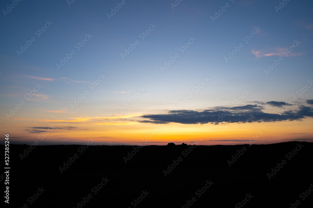 Evening sunset over a dark horizon in the country