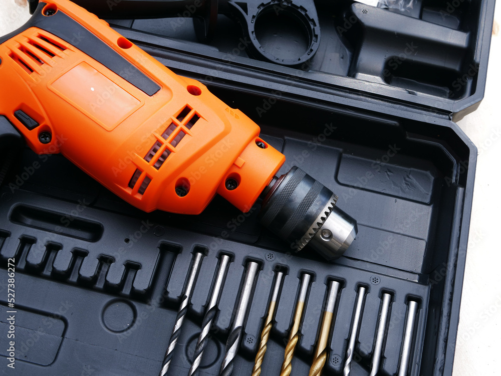 Electric power drill with bits for diy close up shot Electric power drill with bits for diy close up shot