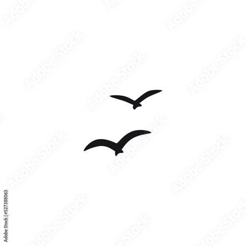A flock of flying silhouette birds. Vector illustration