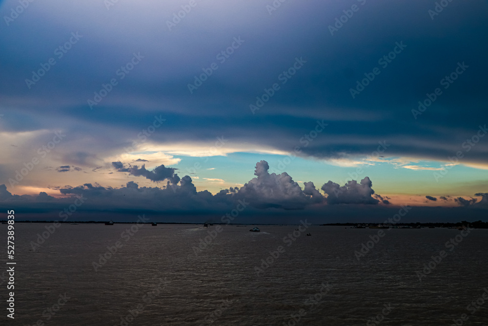 Summer cloudy sky on the river in Bangladesh