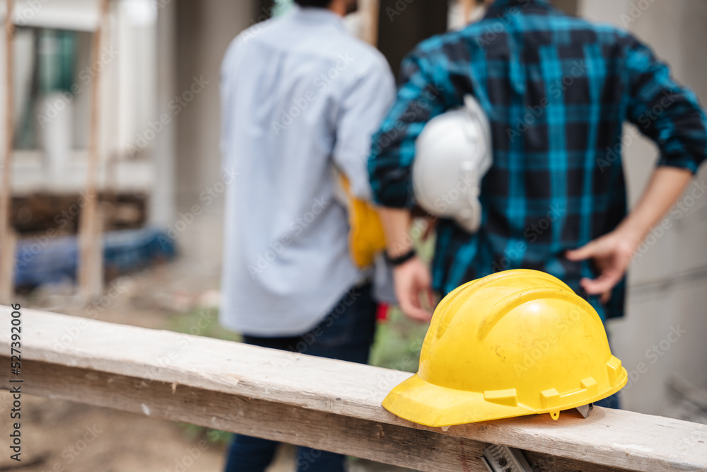 The importance of safety gear for construction workers and the presence of a helmet at a construction site The importance of safety gear for construction workers and the presence of a helmet at a construction site