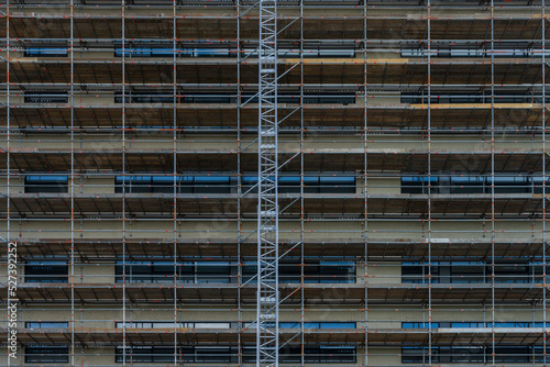 Scaffolding on the facade of the house. Restoration of the facade.