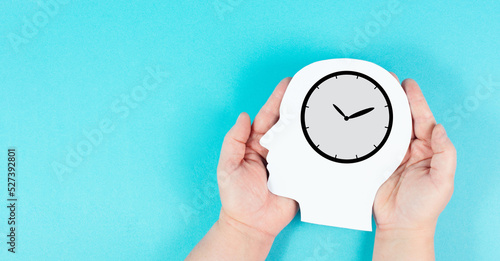 Fototapeta Naklejka Na Ścianę i Meble -  Silhouette of a head with a clock, time pressure and management in business, having a deadline or appointment, efficiency planning