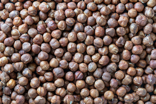 Dry hazelnuts background. Heap of peeled hazelnuts kernels