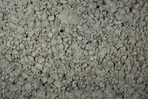 close up of a gray foam concrete building block. grey textured background