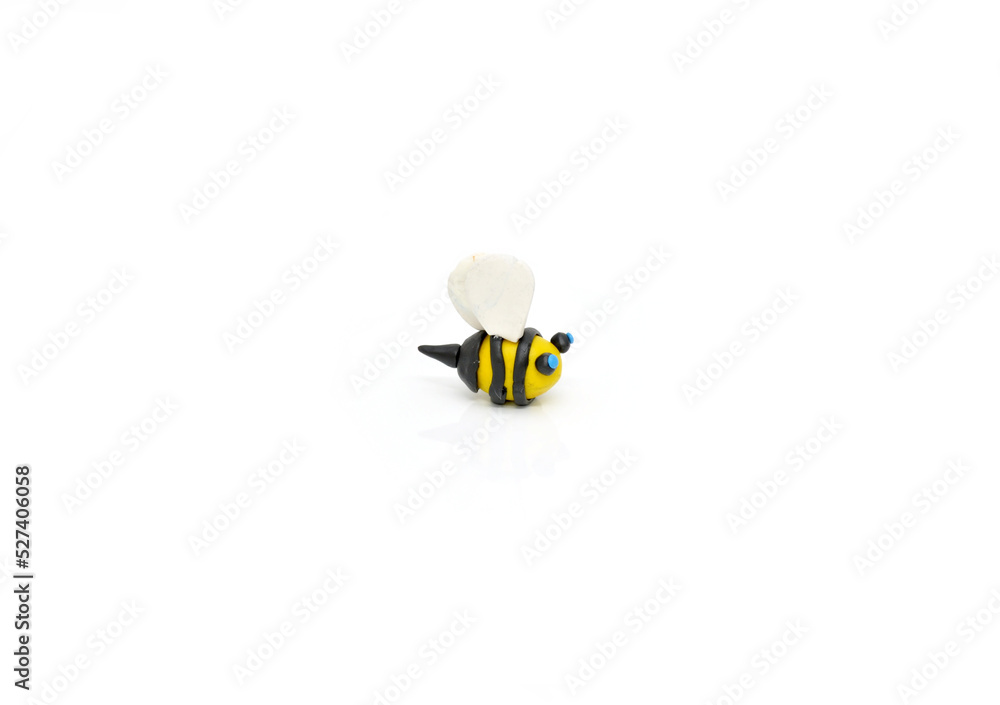 honey bee made of plasticine is isolated on white background honey bee made of plasticine is isolated on white background