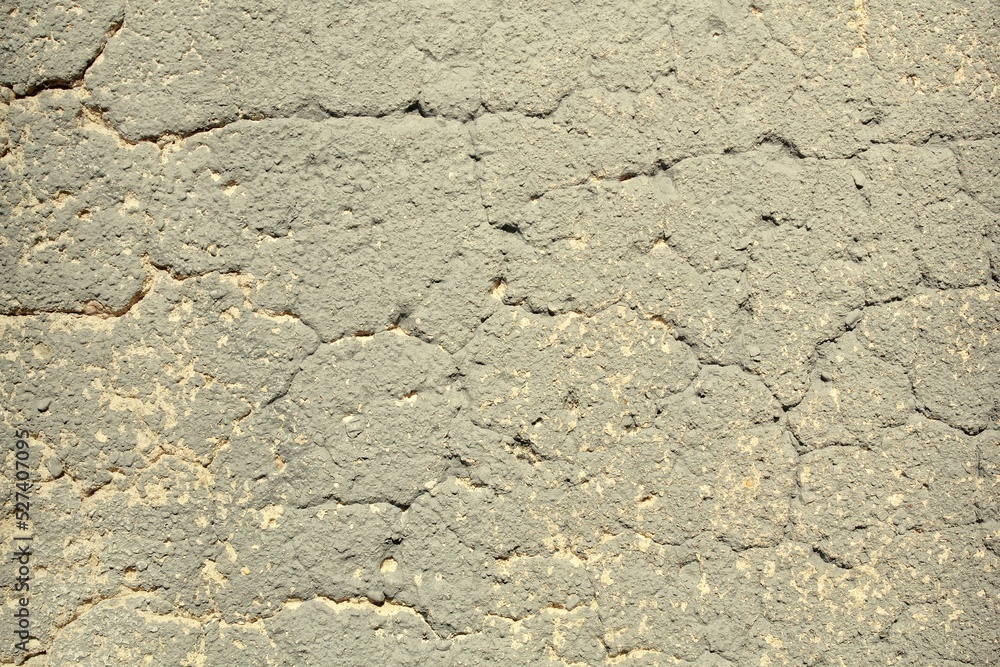 Old foundation crack concrete cement surface grey wall texture background. Design pattern of wall with paint beige spots. Architecture grunge modern abstract style element. Close-up, copy space Old foundation crack concrete cement surface grey wall texture background. Design pattern of wall with paint beige spots. Architecture grunge modern abstract style element. Close-up, copy space