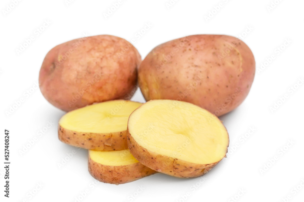 Raw potato with sliced potato on a white. Raw potato with sliced potato on a white.
