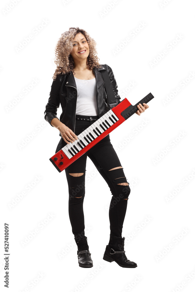 Young female musician playing a keytar synthesizer Young female musician playing a keytar synthesizer