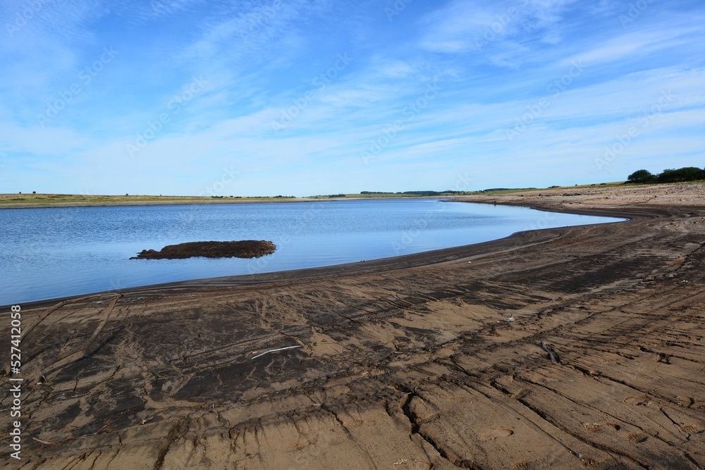 Colliford lake reservoir on Bodmin Moor showing very low levels of water.