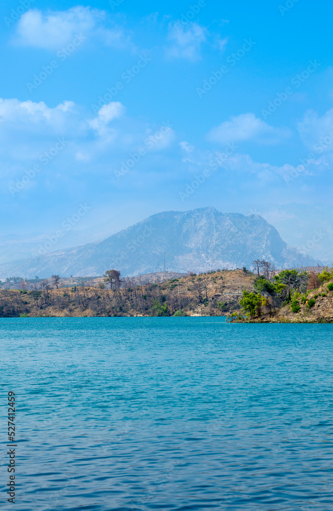 Natural beauty of Turkey. Mountains, green pines, turquoise lake. Mountain landscape with forest, trees. Beautiful mountain lake backround. Rocks Natural beauty of Turkey. Mountains, green pines, turquoise lake. Mountain landscape with forest, trees. Beautiful mountain lake backround. Rocks