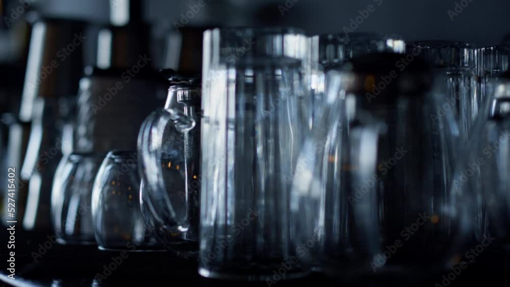 Bartender clean cocktail glasses for various drinks closeup. No people pub Bartender clean cocktail glasses for various drinks closeup. No people pub