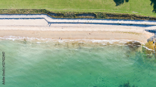 Aerial view on beach and coast of see in Helen s Bay  Northern Ireland. Drone shot sunny day 